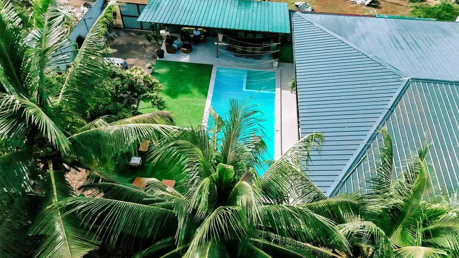 The villa from above among coconut trees