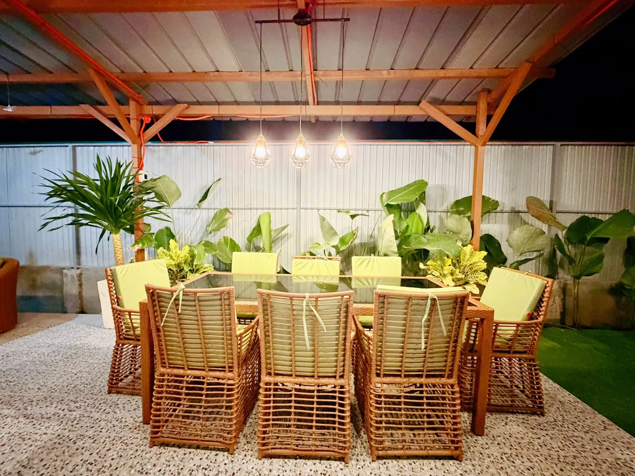 Covered outdoor dining pavilion with long tables