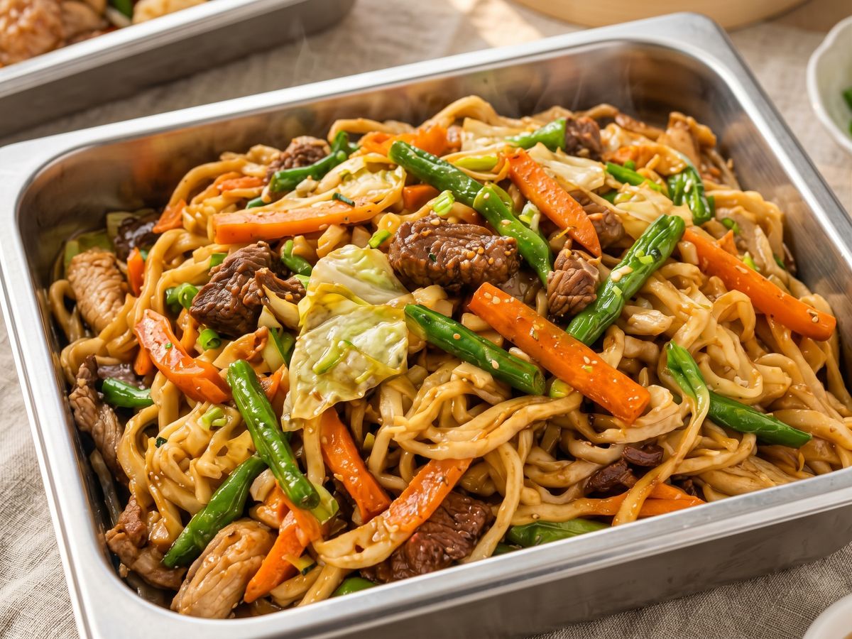 A tray of stir-fried noodles from the food tray menu